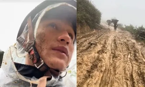 Bùn bắn đầy mặt, thầy giáo trẻ kiên trì hướng dẫn học trò đến trường